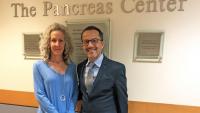 Patient Kerry Alvarado stands next to her oncologist, Dr. Gulam Manji